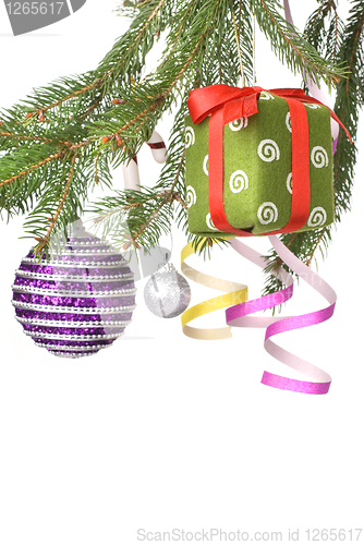 Image of Christmas balls, gift and decoration on fir tree branch isolated