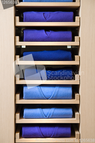 Image of store shelf with color clothes