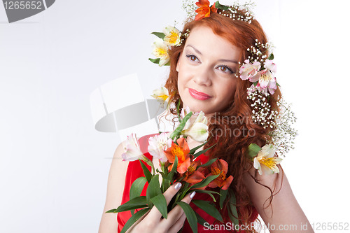 Image of Portrait of beautiful woman with spring flowers 