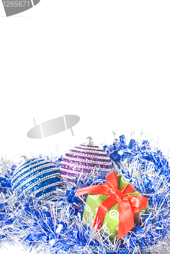 Image of christmas balls with and gift with decoration isolated on white