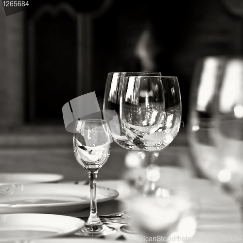 Image of black and white photo of glass goblets on the table