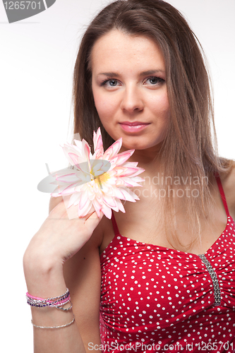 Image of Attractive woman in red dress posing on white