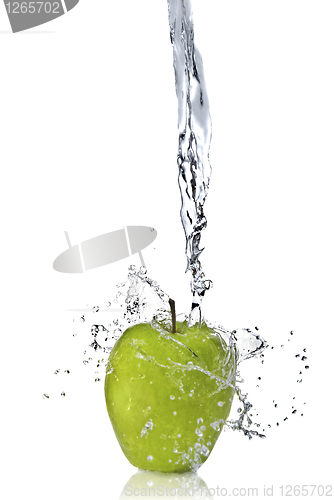 Image of fresh water splash on green apple isolated on white