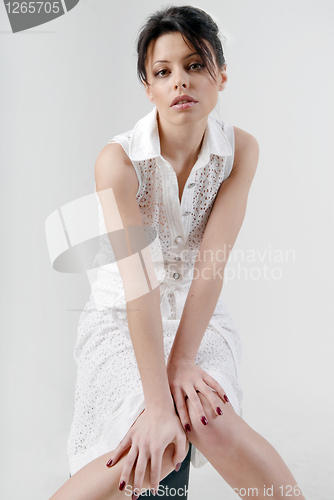 Image of Beautiful brunette in white dress