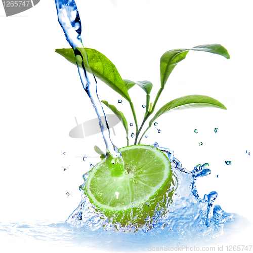 Image of water drops on lime with green leaves isolated on white