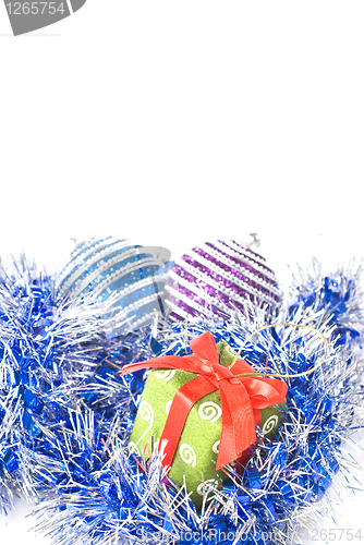 Image of christmas balls with and gift with decoration isolated on white