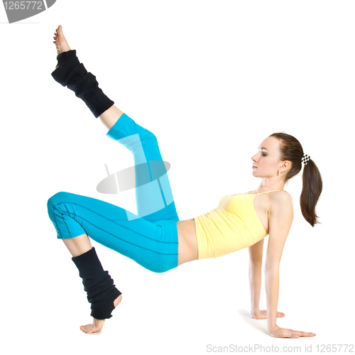 Image of beautiful girl doing gymnastics on white background