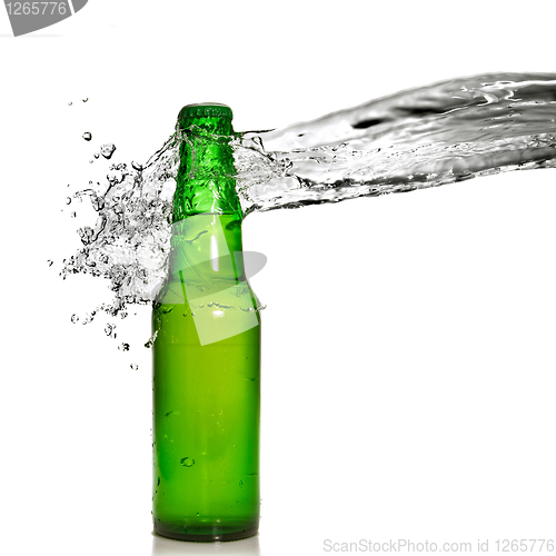 Image of Green beer bottle with water splash isolated on white
