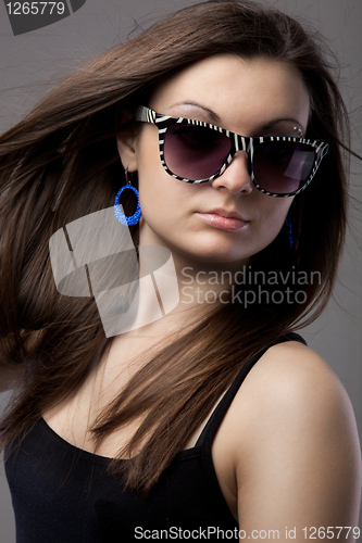 Image of Portrait of attractive young woman in glasses