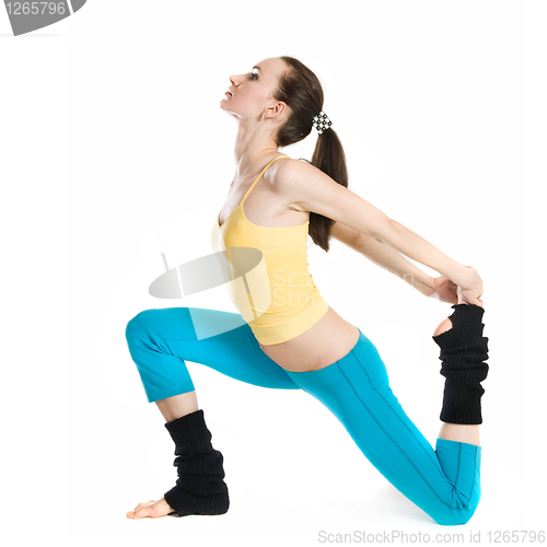 Image of beautiful girl doing gymnastics on white background