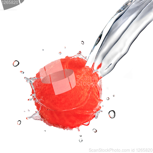 Image of fresh water splash on red grapefruit isolated on white