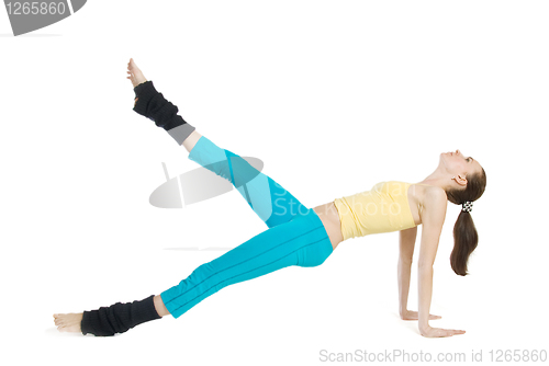 Image of beautiful girl doing gymnastics on white background