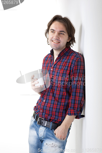 Image of man holding cup on white