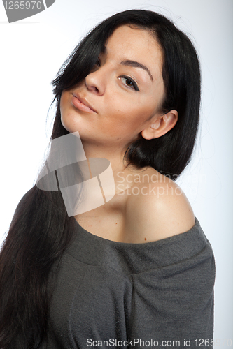 Image of Portrait of attractive young woman on white