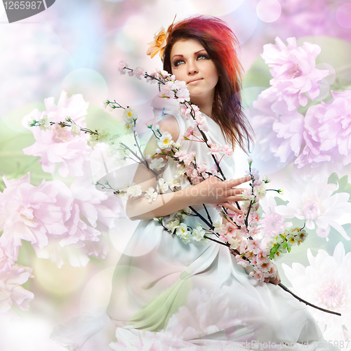 Image of Portrait of beautiful woman with spring flowers 