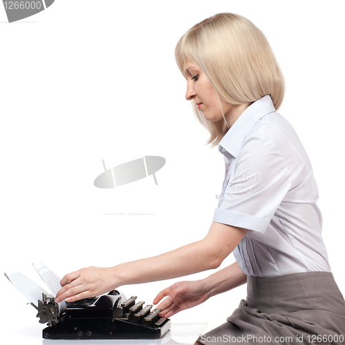 Image of Business woman with vintage typing machine on white