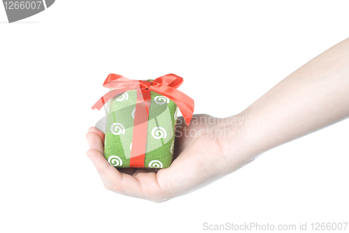 Image of Hand holding gift isolated on white