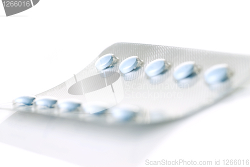 Image of pack of blue tablets isolated on white