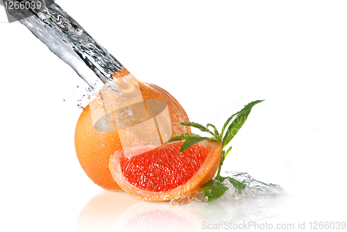 Image of Water splash on grapefruit with mint isolated on white