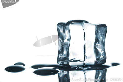 Image of ice cube with water drops on white