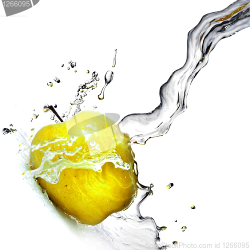 Image of fresh water splash on yellow apple isolated on white