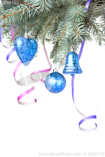 Image of Christmas balls and decoration on fir tree branch isolated on wh