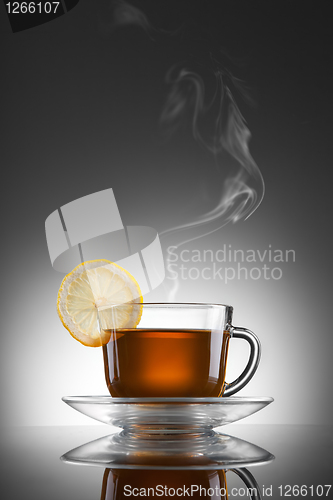 Image of cup of hot tea with lemon and steam