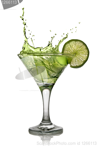 Image of Green alcohol cocktail with splash and green lime isolated on wh