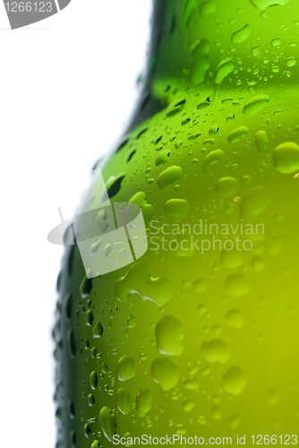 Image of Green beer bottle with water drops isolated on white