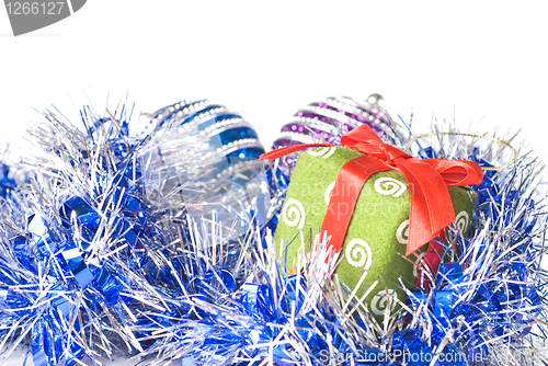 Image of christmas balls with and gift with decoration isolated on white