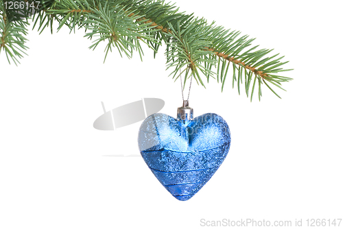 Image of Christmas ball on fir tree branch isolated on white