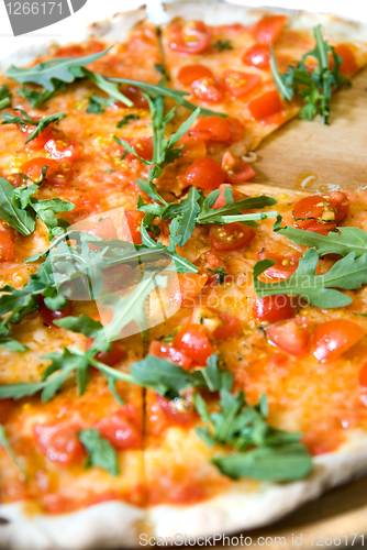 Image of classic italian pizza with tomatos