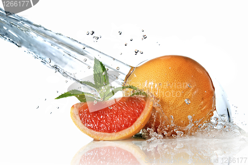 Image of Water splash on grapefruit with mint isolated on white