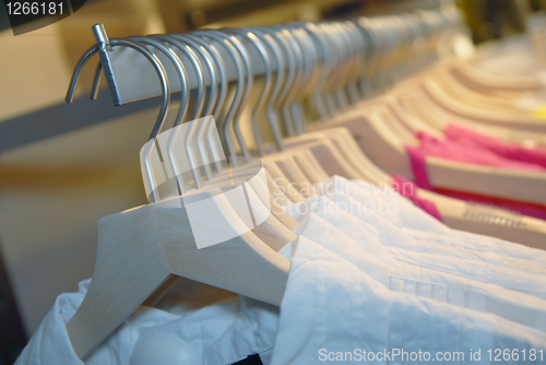 Image of clothes on racks in store