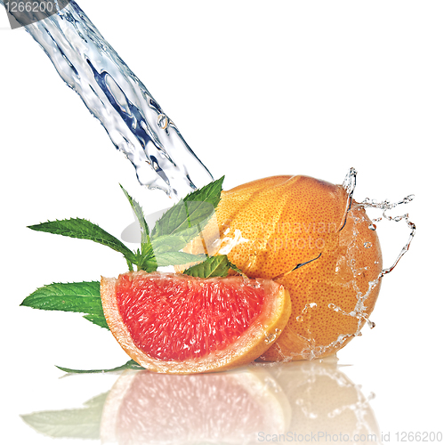 Image of Water splash on grapefruit with mint isolated on white