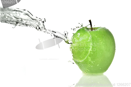 Image of fresh water splash on green apple isolated on white