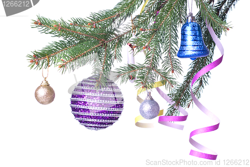 Image of Christmas balls and decoration on fir tree branch isolated on wh