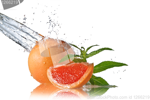 Image of Water splash on grapefruit with mint isolated on white 