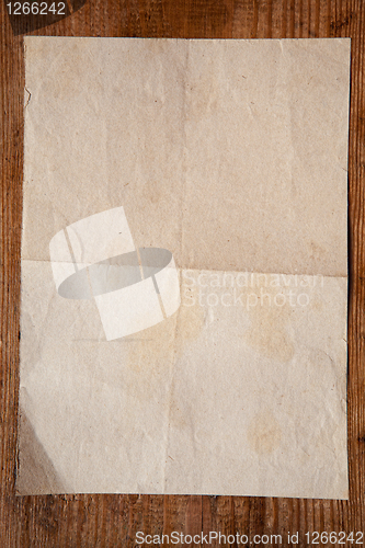 Image of old paper on wood