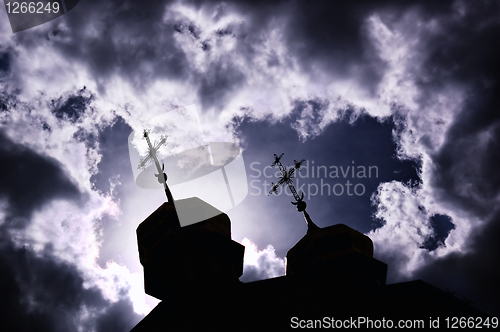 Image of silhouette of church with crosses