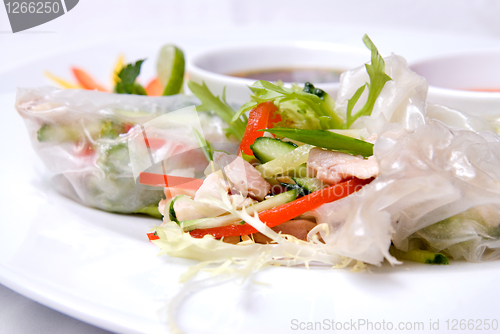 Image of chinese rolls with vegetables on the plate