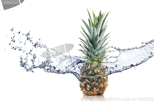 Image of pineapple with water splash isolated on white