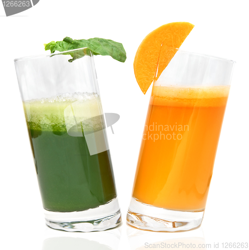 Image of fresh juices from carrot and parsley in glasses isolated on white