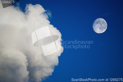 Image of moon and clouds on the blue sky