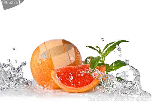 Image of Water splash on grapefruit with mint isolated on white