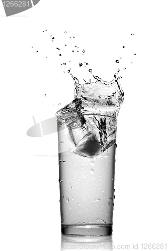 Image of water splash in glass isolated on white