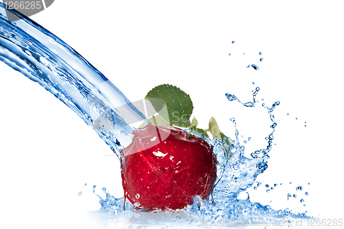 Image of Red apple with leaf and water splash isolated on white