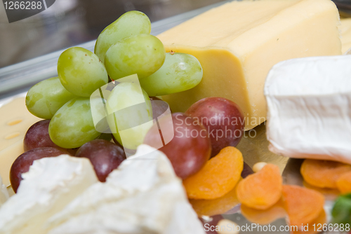 Image of appetizer from cheese and grape