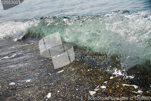 Image of sand stones and water wave