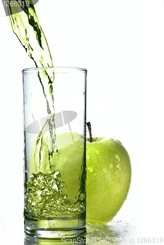 Image of fresh apple juice in glass with green apple isolated on white